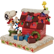 Jim Shore Peanuts Snoopy Decorating the Doghouse Figurine